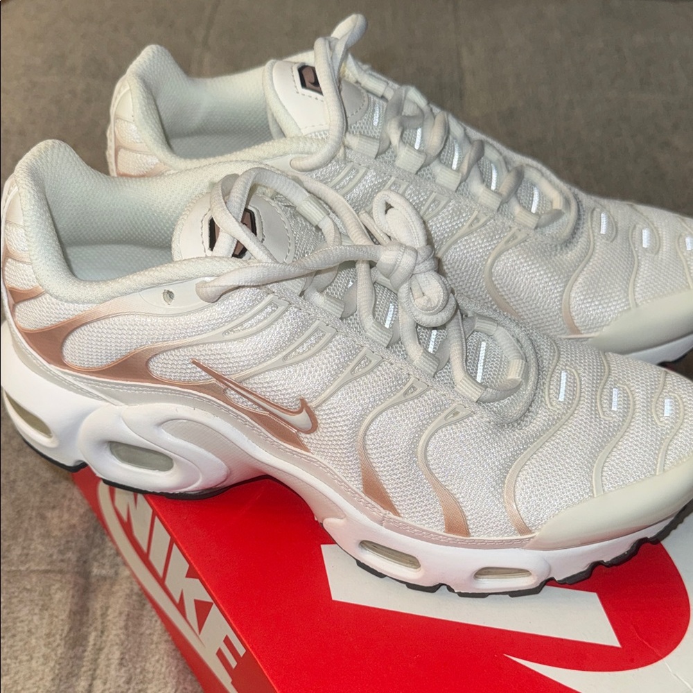 Nike Women's White Sneakers with Metallic Rose Accents
